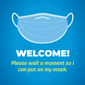 blue and white poster titled ‘welcome’ with image of mask with trailing ‘please wait a moment so I can put on my mask’ text